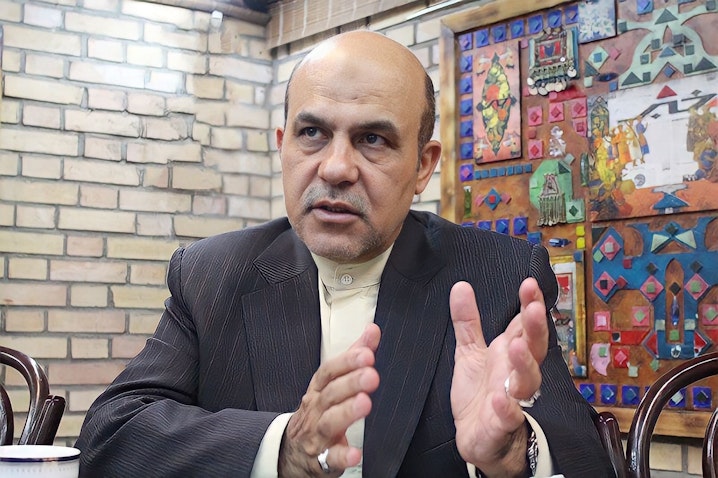 Former deputy defense minister Alireza Akbari sits for an interview in Tehran, Iran. Date unknown. (Photo via Khabar Online)