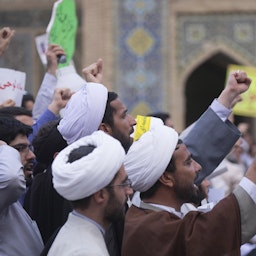 University students and clergymen protest in front of the Feyziya Madrasa in Qom, Iran on May 30, 2015. (Photo via Getty Images)