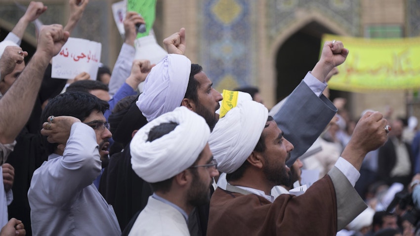 University students and clergymen protest in front of the Feyziya Madrasa in Qom, Iran on May 30, 2015. (Photo via Getty Images)