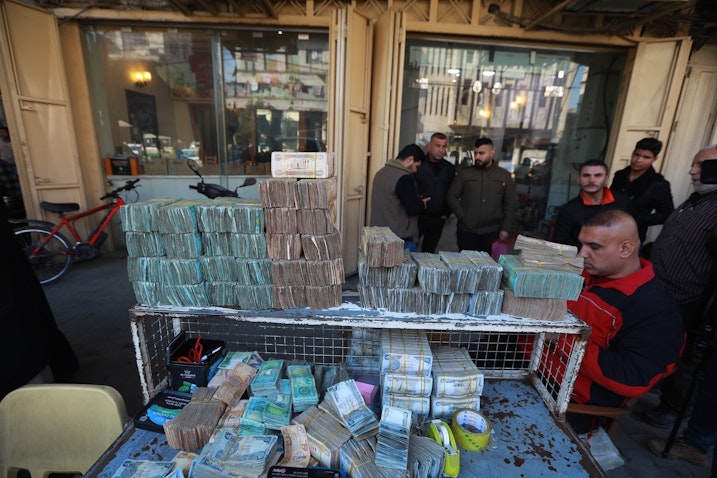 Citizens buy and exchange foreign currency at an exchange office in Baghdad, Iraq on Jan. 25, 2023. (Photo via Getty Images)