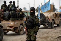 Syrian Kurdish Asayish security forces deploy during a raid against suspected Islamic State group fighters in Raqqa, Syria on Jan. 28, 2023. (Photo via Getty Images)