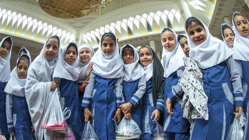 Schoolgirls visit a shrine in the southern Iranian city of Shiraz on Oct. 23, 2015. (Photo via Getty Images)