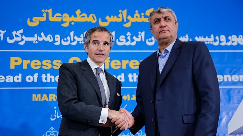 IAEA Director General Rafael Grossi and AEOI Head Mohammad Eslami shake hands after a joint press conference in Tehran, Iran on Mar. 4, 2023. (Photo via Fars News Agency)