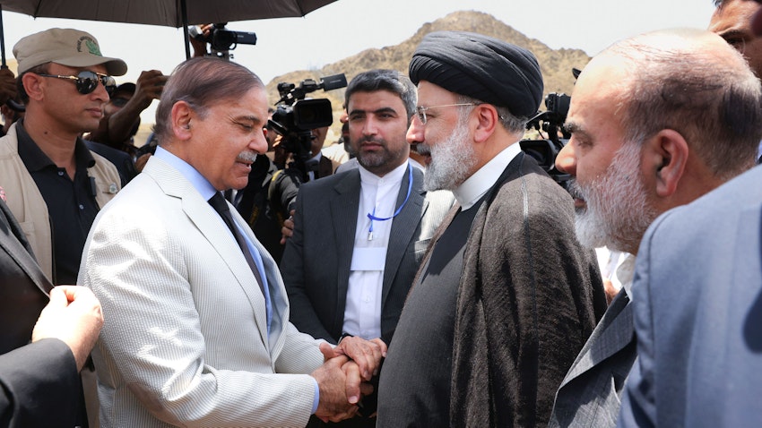 Iran's President Ebrahim Raisi and Pakistani Prime Minister Shehbaz Sharif meet on the border in Sistan-Baluchestan Province, Iran on May 18, 2023. (Photo via Iranian presidency)
