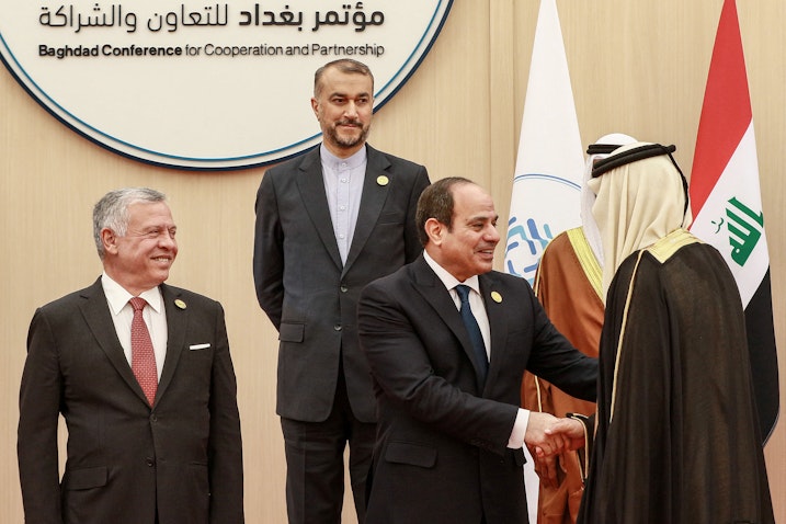 Jordan’s King and Iran’s foreign minister look on as Egypt's president shakes hands with a dignitary at the Baghdad Conference in Sweimeh, Jordan on Dec., 20, 2022. (Photo via Getty Images)