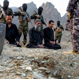 Jaish Ul-Adl members seen pointing guns at alleged spies in 2023. Location and exact date unknown. (Photo via social media)