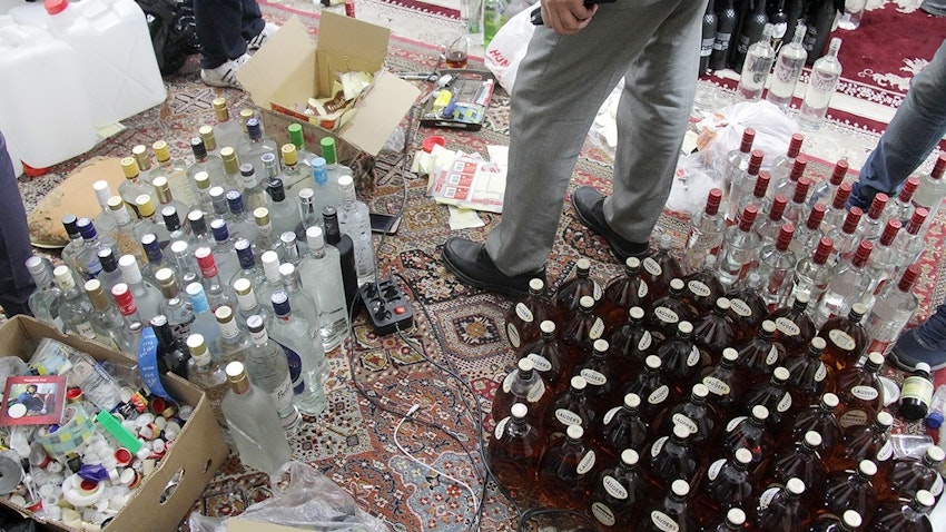Homemade alcoholic drinks are seized from an underground distillery in the religious city of Mashhad, Iran on Dec. 25, 2017. (Photo via IRNA)