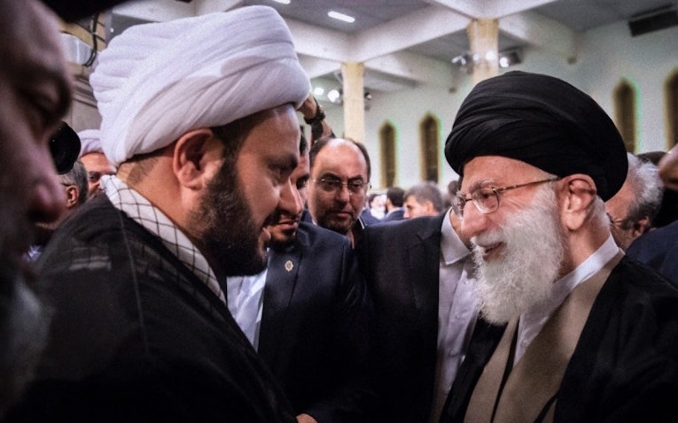File photo of Iran's Supreme Leader Ayatollah Ali Khamenei and head of Harakat Hezbollah Al-Nujaba Akram Al-Kaabi in Tehran, Iran. (Photo via social media)