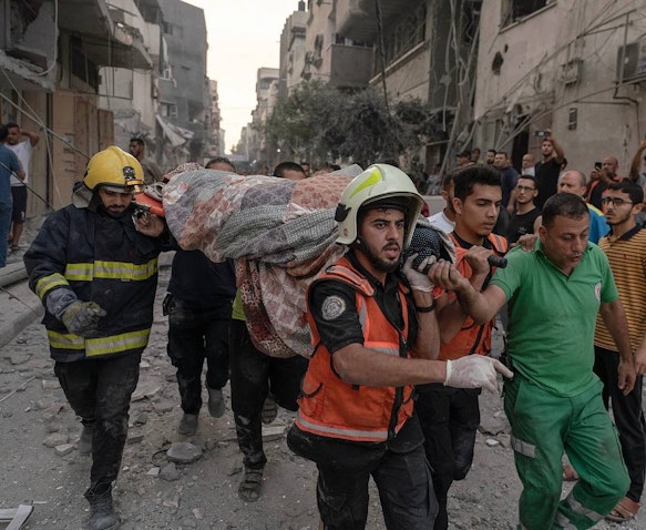 Paramedics transfer casualties from residential building bombed by Israeli warplanes in the Gaza Strip on Oct. 8, 2023. (Source: Motaz_Azaiza/Instagram)