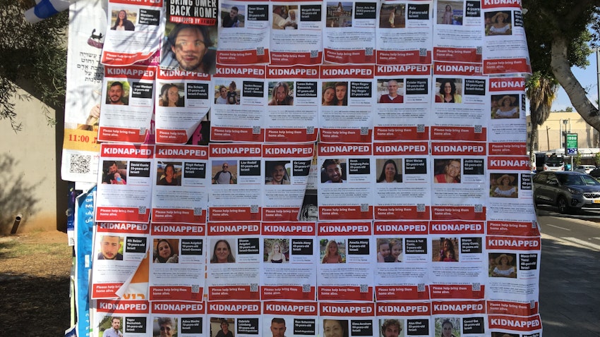 Flyers with images of some of the 239 hostages held by Hamas put up on a board in Tel Aviv on Oct. 20, 2023. (Photo by Yossipik via Wikimedia Commons)
