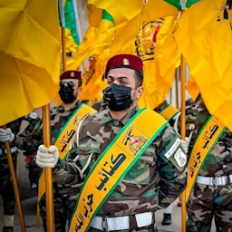 Members of Kata'ib Hezbollah participate in a funeral procession in Baghdad, Iraq on Nov. 21, 2023.  (Photo via Etijah TV)
