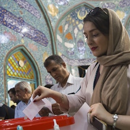 Voters cast their ballots for the presidential and municipal council election in Qom, Iran on May 19, 2017. (Photo via Getty Images)