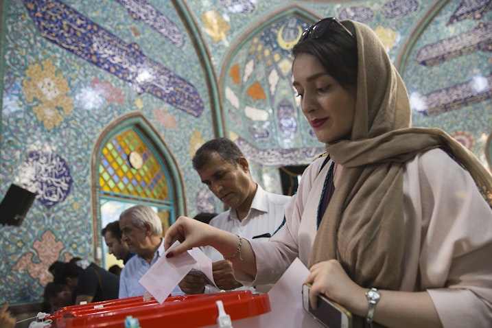 Voters cast their ballots for the presidential and municipal council election in Qom, Iran on May 19, 2017. (Photo via Getty Images)