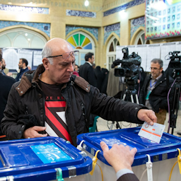 A man casts his ballot in Iran’s 11th parliamentary elections in Tehran on Feb. 21, 2020. (Photo via Fars News Agency)
