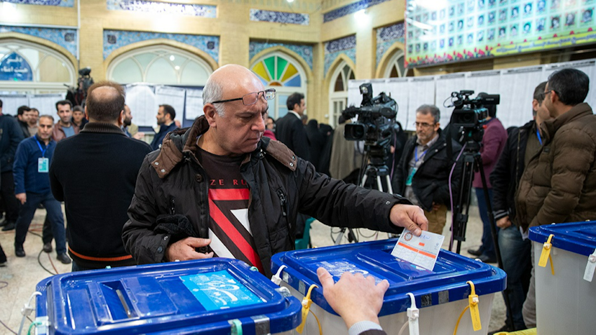 A man casts his ballot in Iran’s 11th parliamentary elections in Tehran on Feb. 21, 2020. (Photo via Fars News Agency)