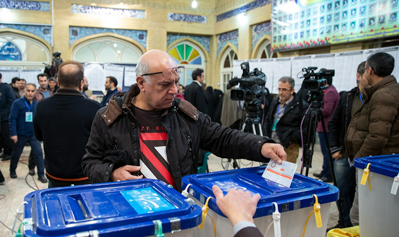 A man casts his ballot in Iran’s 11th parliamentary elections in Tehran on Feb. 21, 2020. (Photo via Fars News Agency)