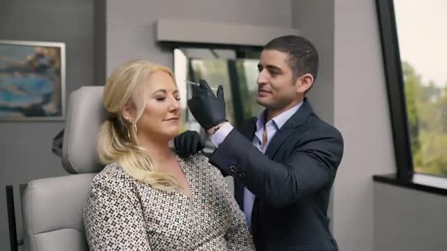 Dr. Courtney treating patient with BOTOX injections at his practice