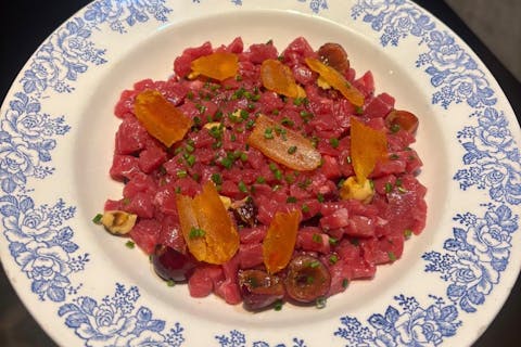 Hand-cut Bortigali beef tartare with cherries, Cabras bottarga and hazelnuts, created by chef Samuele Muscas at Sabores in Cagliari.