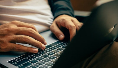 Typing on a laptop 2