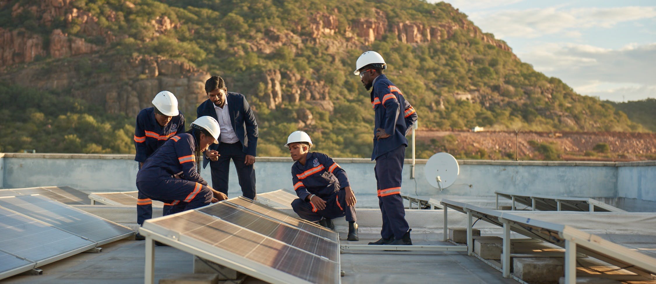 employer teaching students about solar panel technology