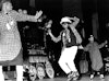 Tupac (far left) onstage with Shock G and Digital Underground. Photo by Al Pereira/Michael Ochs Archives/Getty Images.