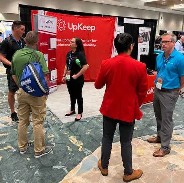 members of the upkeep team talking to conference attendees