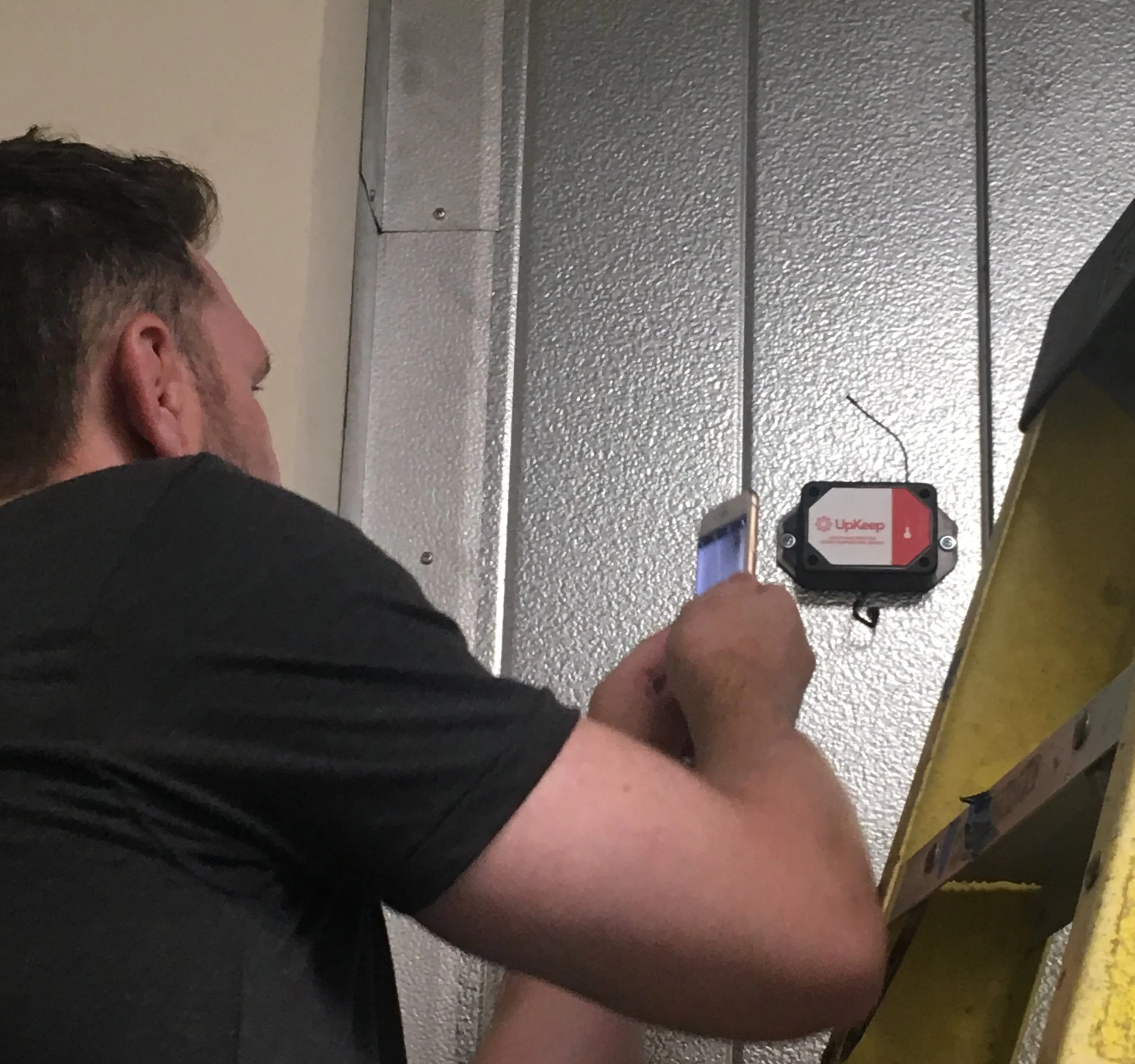 maintenance technician installing upkeep edge