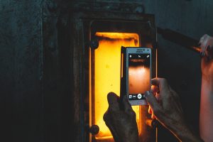 Smartphone photographing a fire - demonstrating the use of IoT