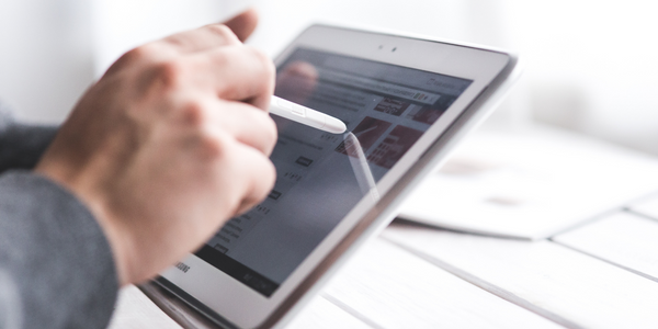 Person scrolls through images on a tablet