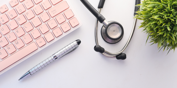 Stethoscope next to a computer