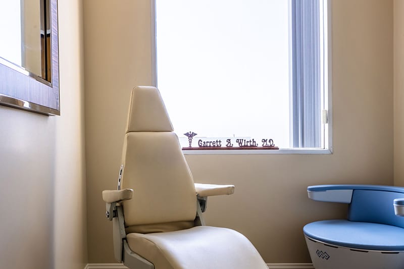 A close up view of one of the procedure chairs in one of the patient rooms at Wirth Plastic Surgery