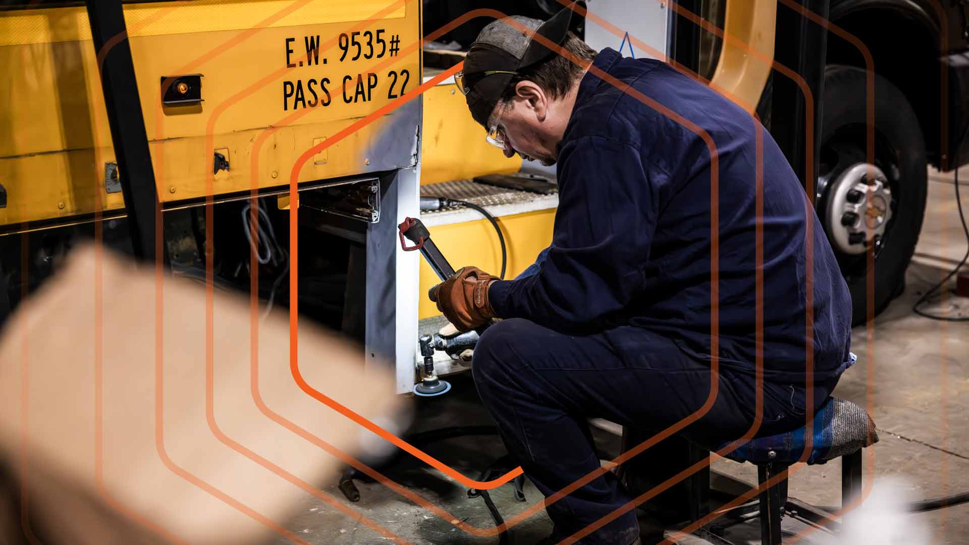 Man working on a heavy duty vehicle.