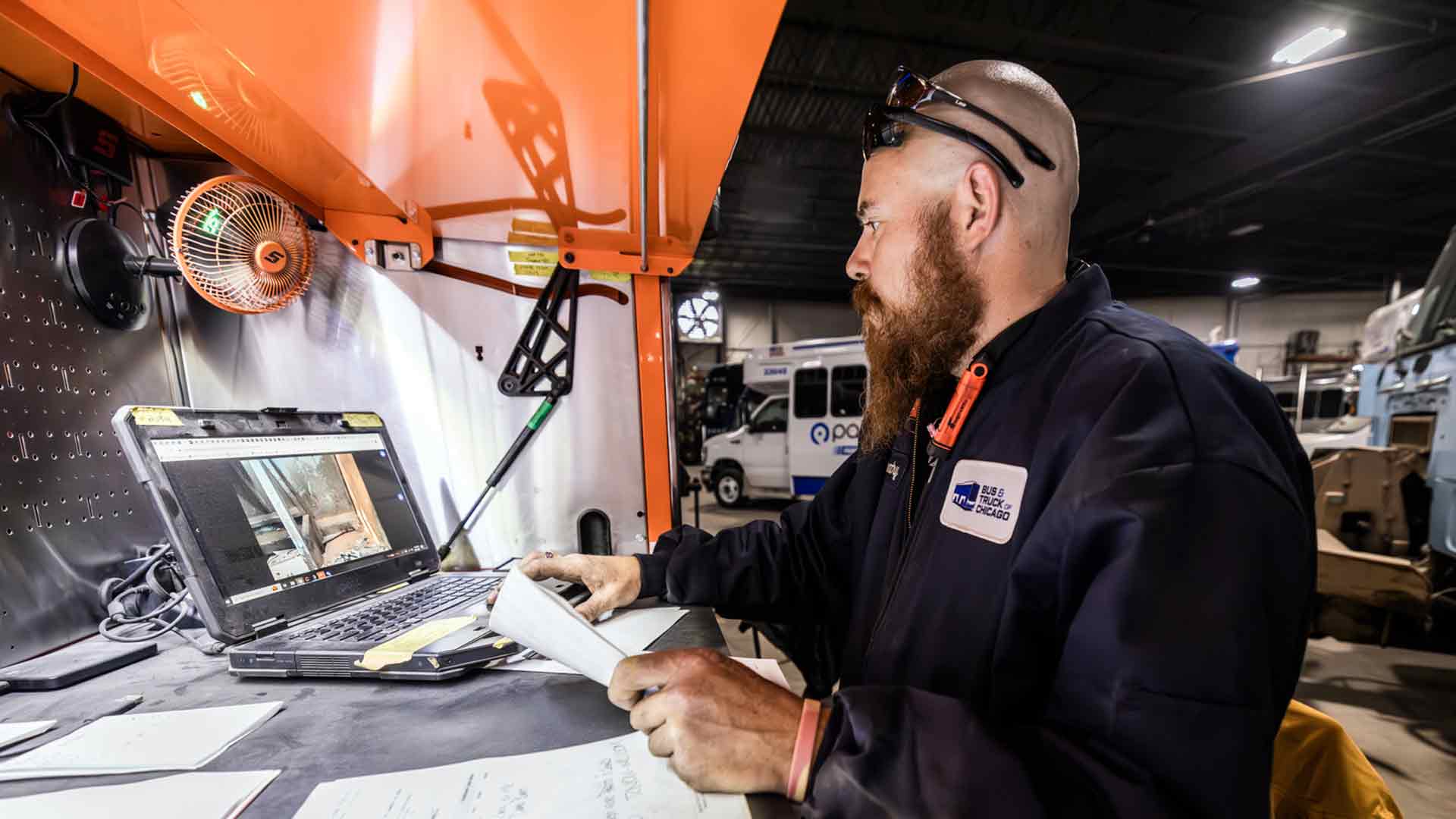 Heavy Duty Tech working on laptop