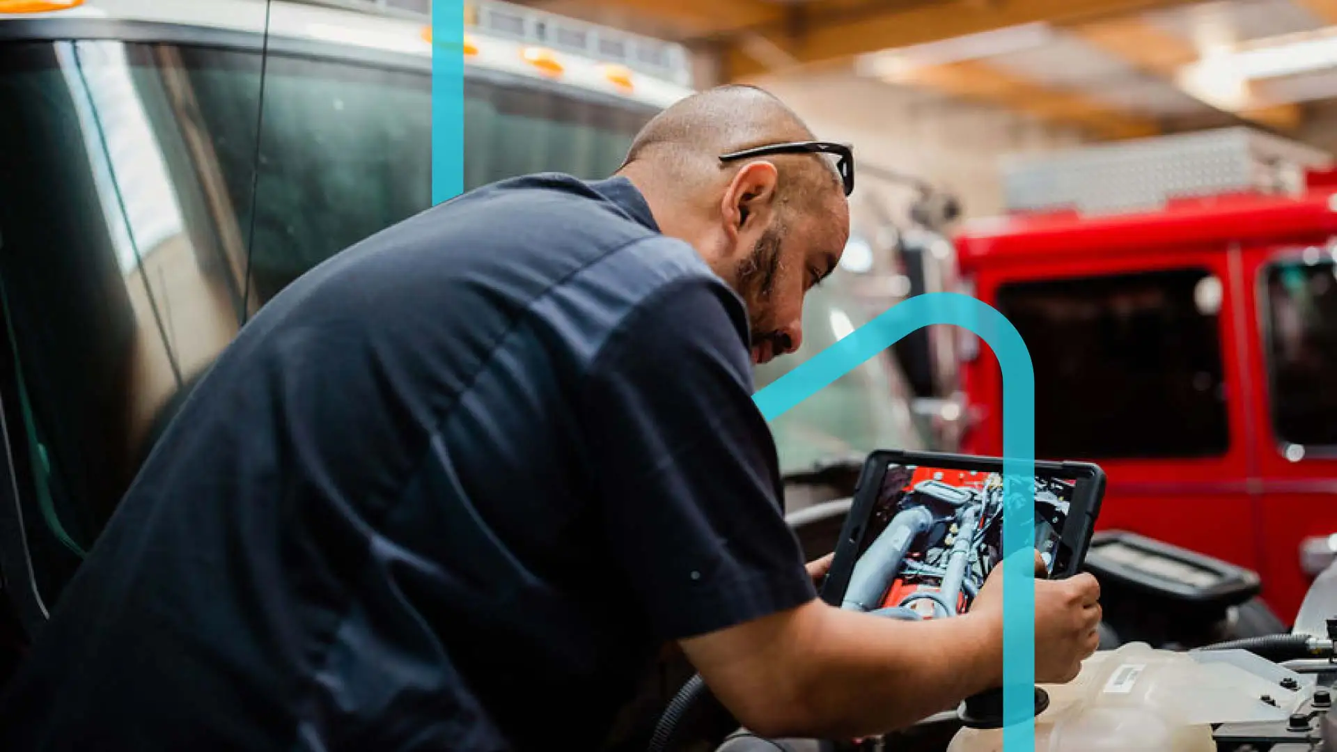 Man using Shopmonkey on a tablet in an auto shop with a blue graphic design.