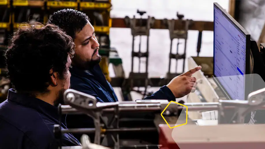 two dudes looking at a computer