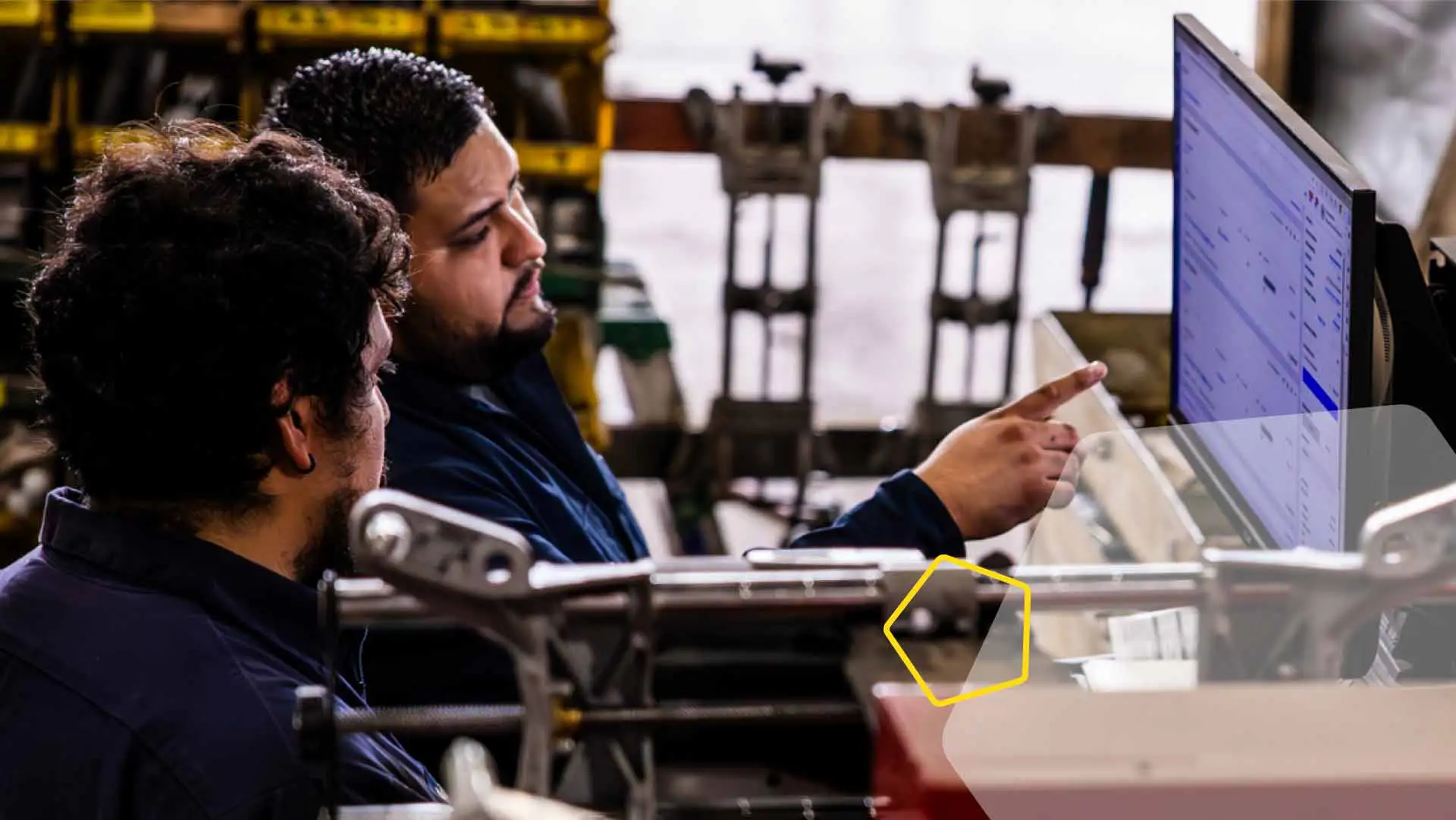 two dudes looking at a computer