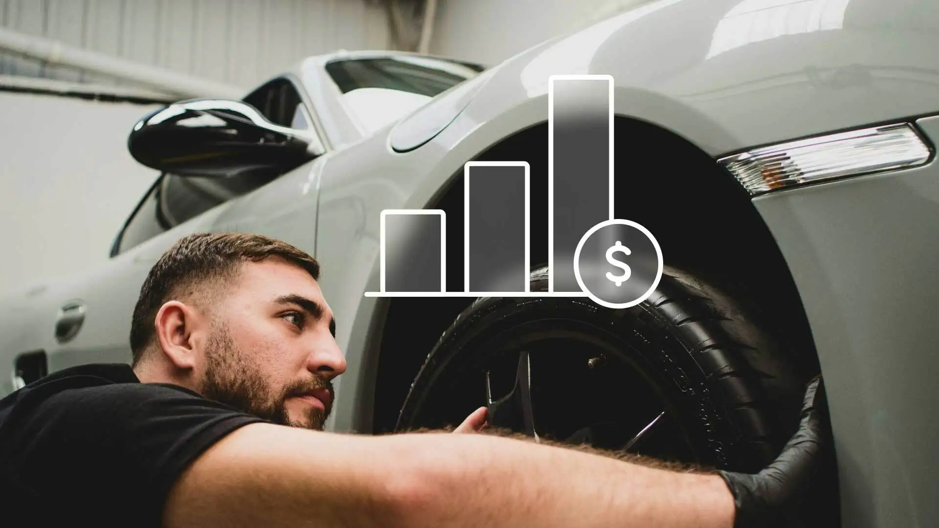 A mechanic doing exterior detailing on a vehicle.