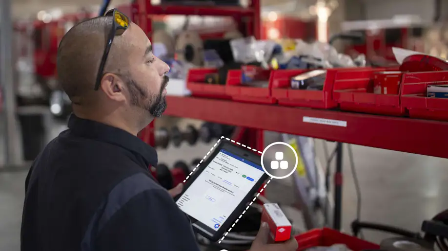An automotive technician taking inventory.