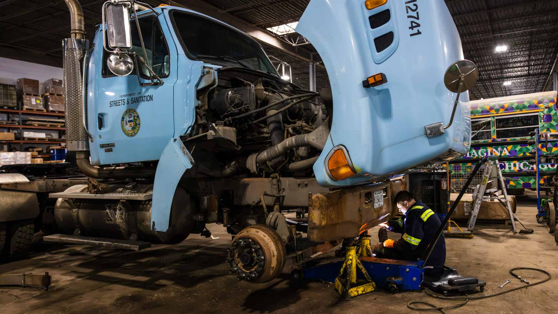 A technician working on a heavy duty truck.