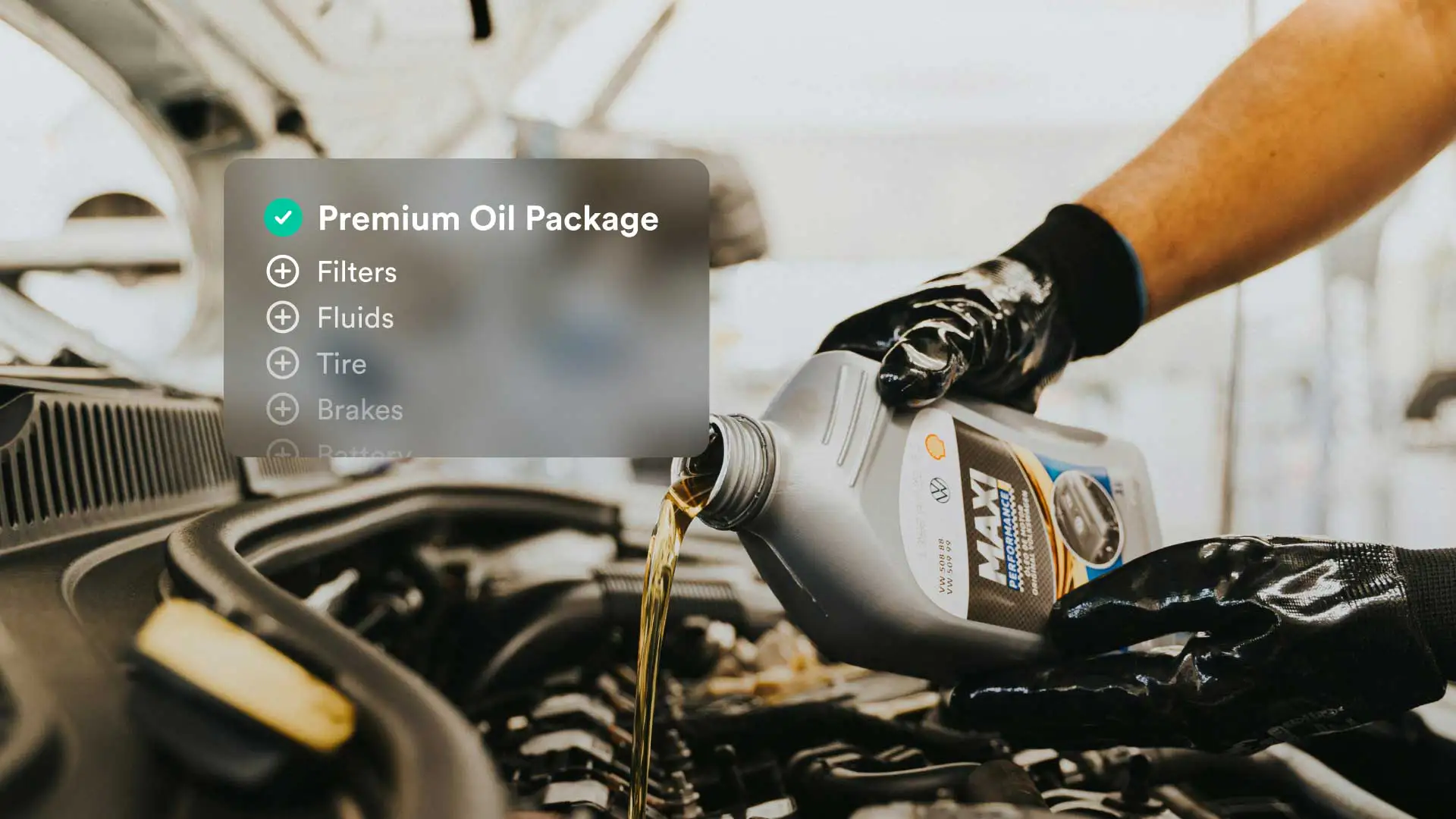 An auto technician changing a vehicle's oil.