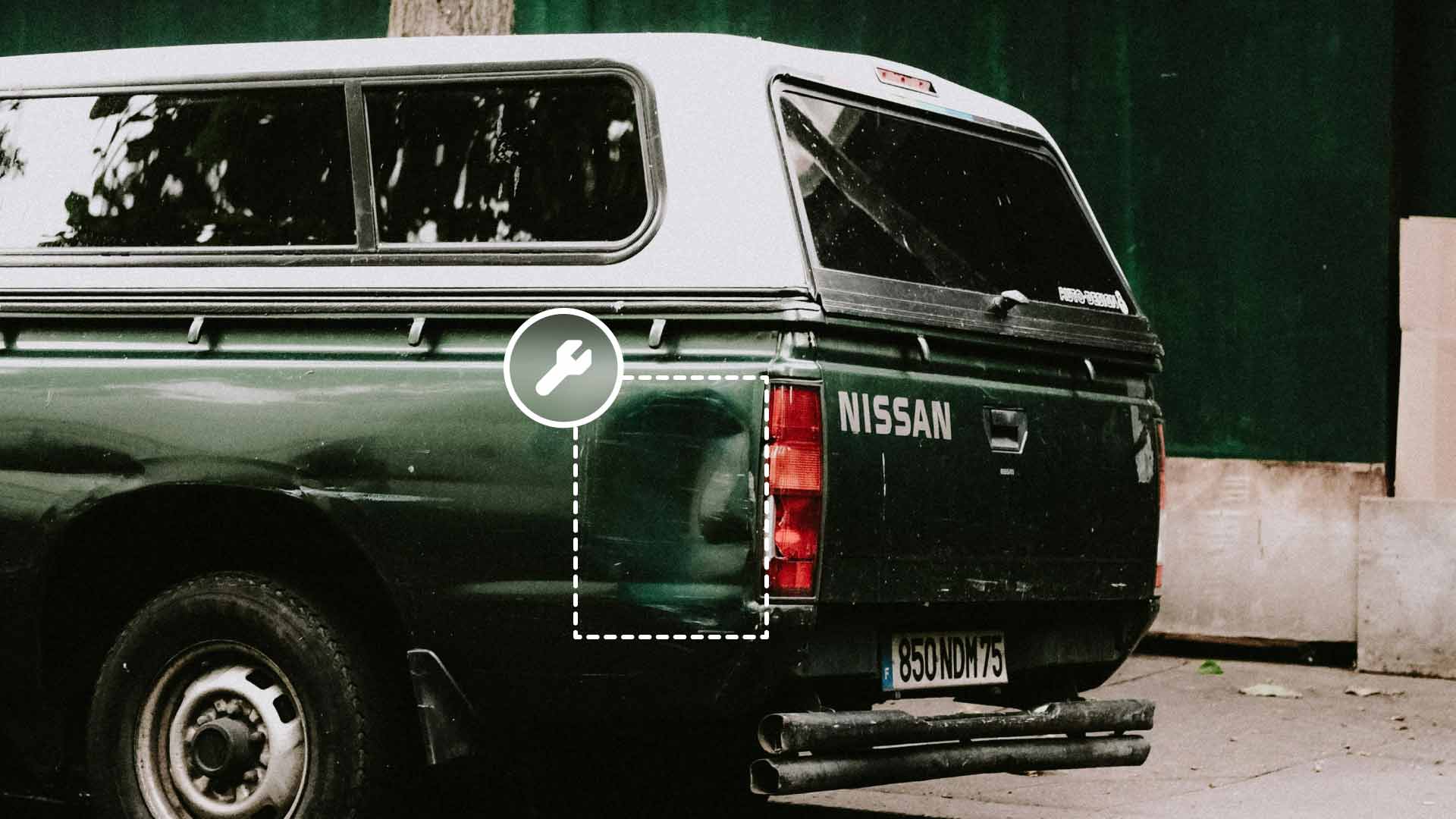 A vehicle with a dented side pannel.