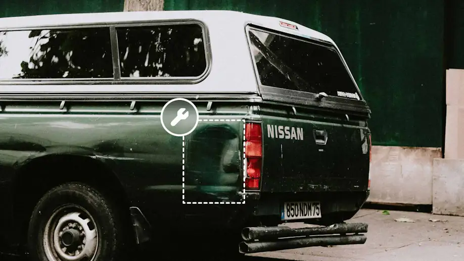 A vehicle with a dented side pannel.