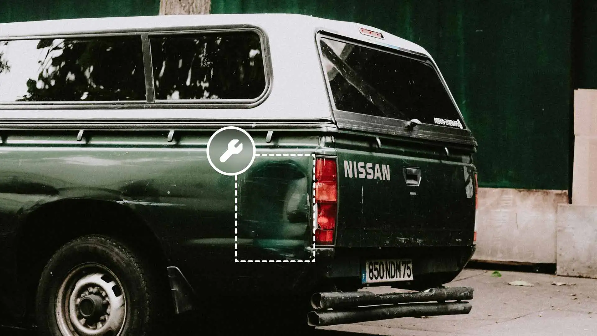 A vehicle with a dented side pannel.