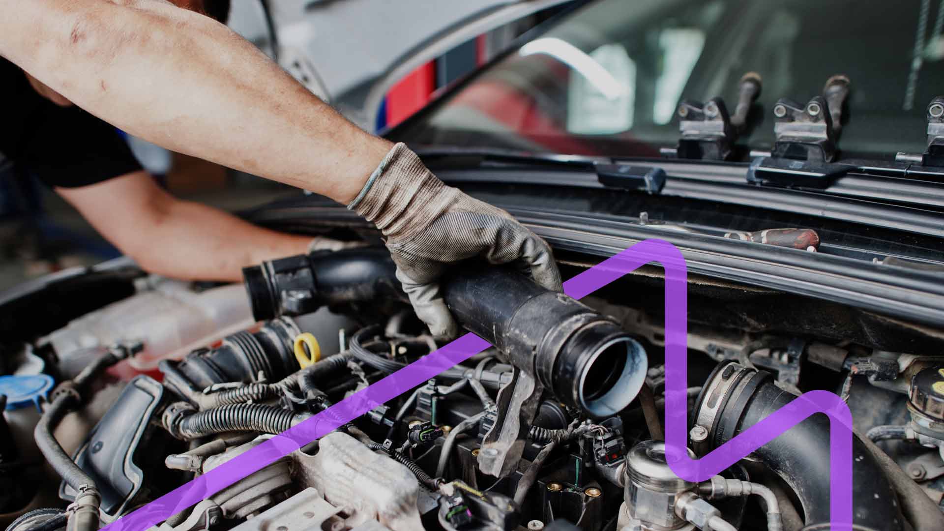 An automotive technician installing a customer-supplied auto part.