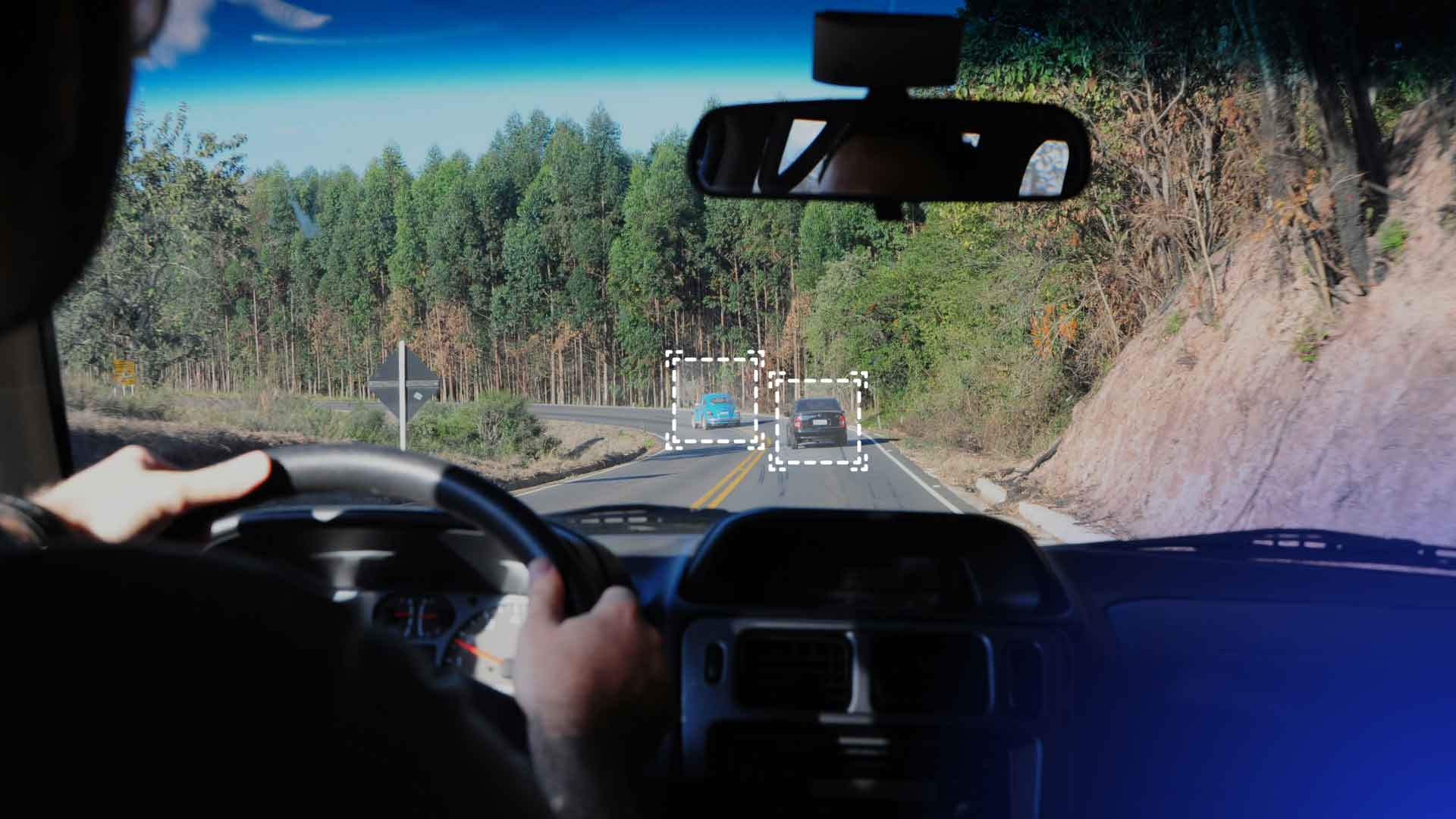 A vehicle's sensors detecting other drivers on the road.