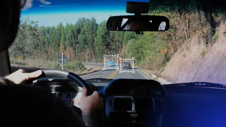 A vehicle's sensors detecting other drivers on the road.