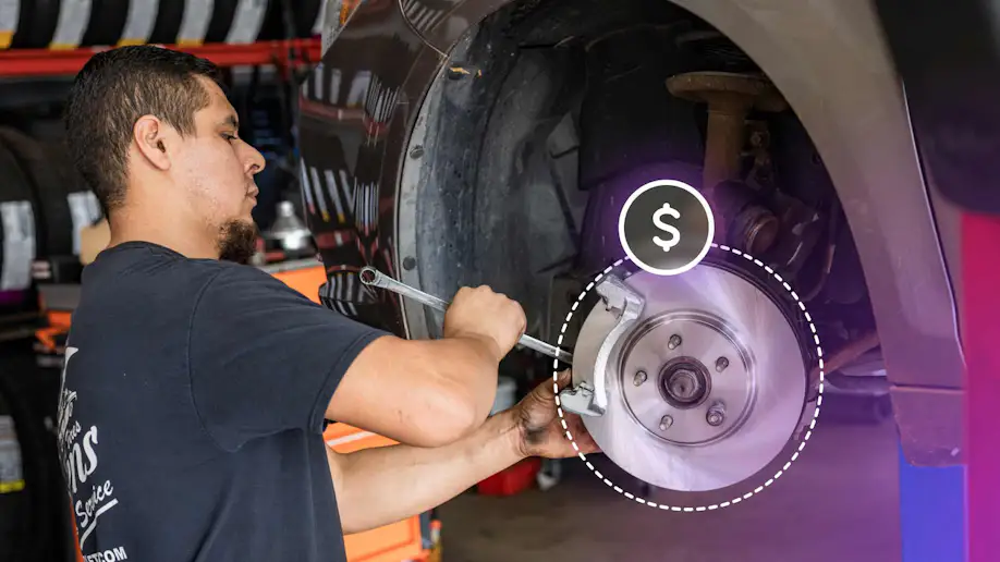 An auto technician working on a profitable repair job.