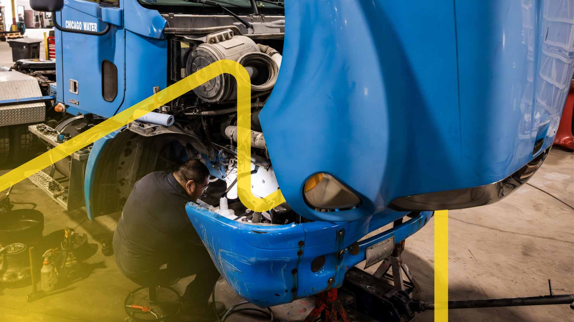 A heavy duty truck engine being repaired.