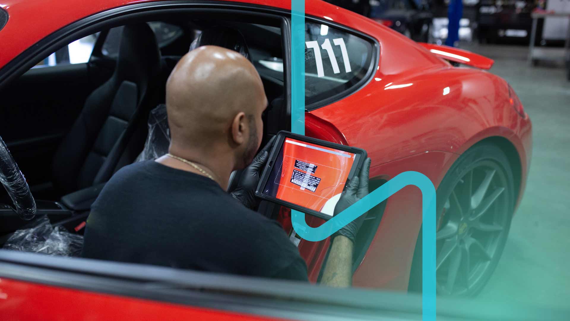 An auto technician using a mobile app for vehicle diagnostics.