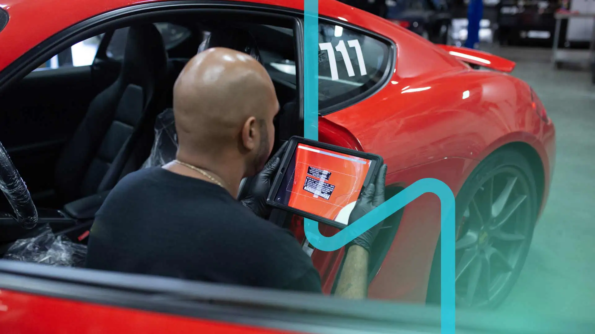 An auto technician using a mobile app for vehicle diagnostics.